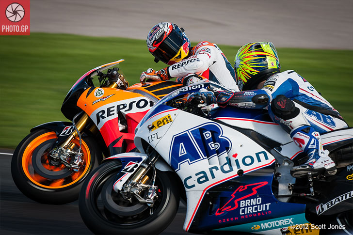Casey Stoner with Karel Abraham at Valencia 2012