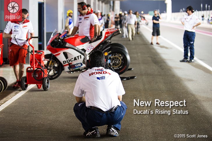 Honda mechanics watches Ducati